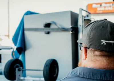 A worker inspects a loaded truck