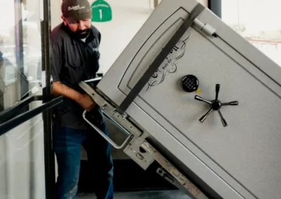 The business owner moves a gun safe