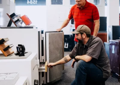 The store owner shows a storage compartment