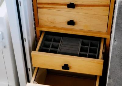 Drawers with foam-padded storage compartments