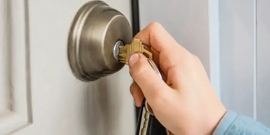 A man opens a door lock